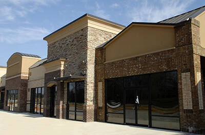 Gas Station with Owner’s Residence & Small Plaza