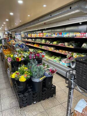 Busy corner grocery store beside subway station priced for sale