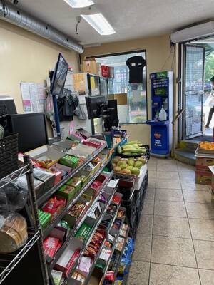 Busy corner grocery store beside subway station priced for sale